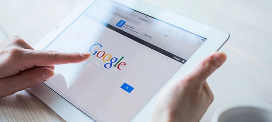 A person looking at Google on their iPad.