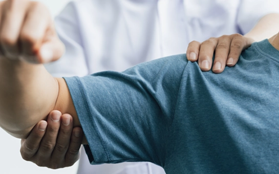 A patient receiving an arm exam.